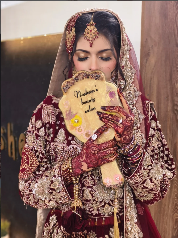 Real Bride holding Nosheen's Beauty Salon Stand